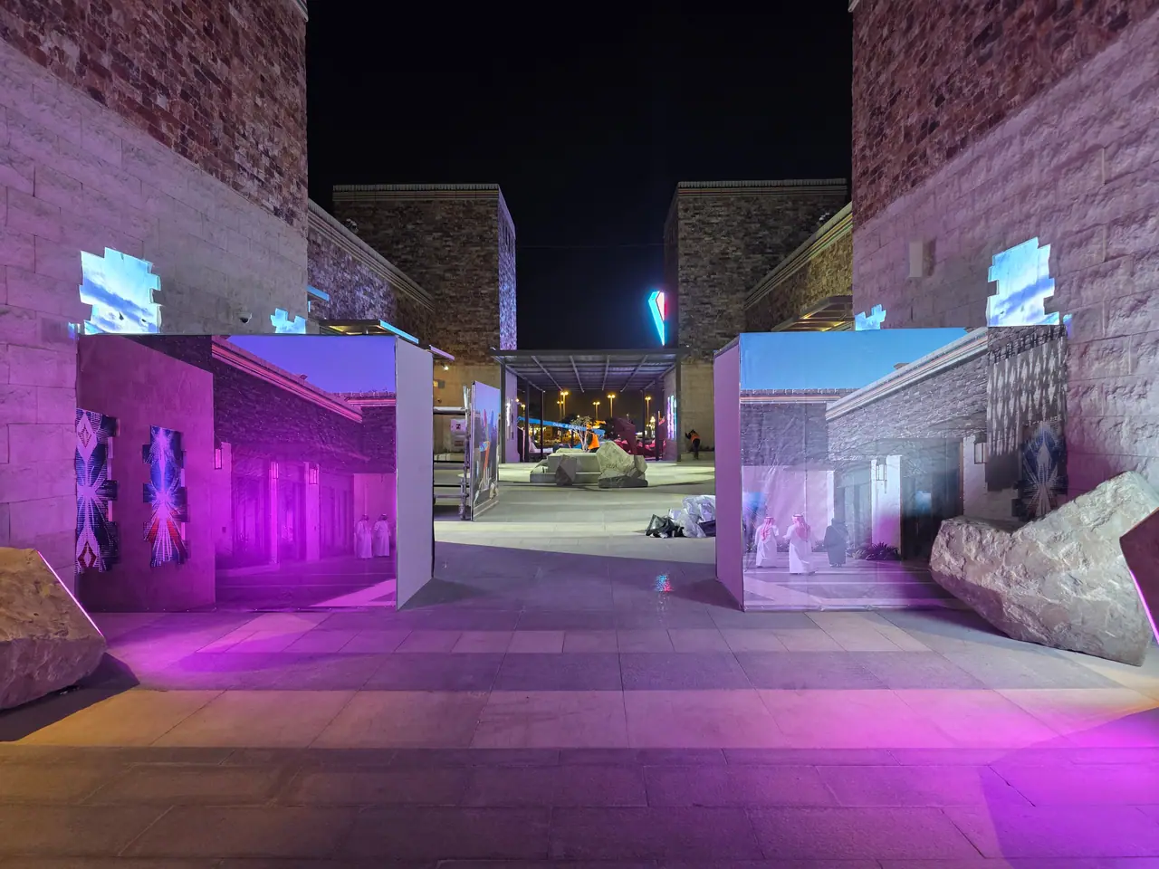 Seven Abha — Destination Graphics & Wayfinding — Plaza hoardings lit for the opening night