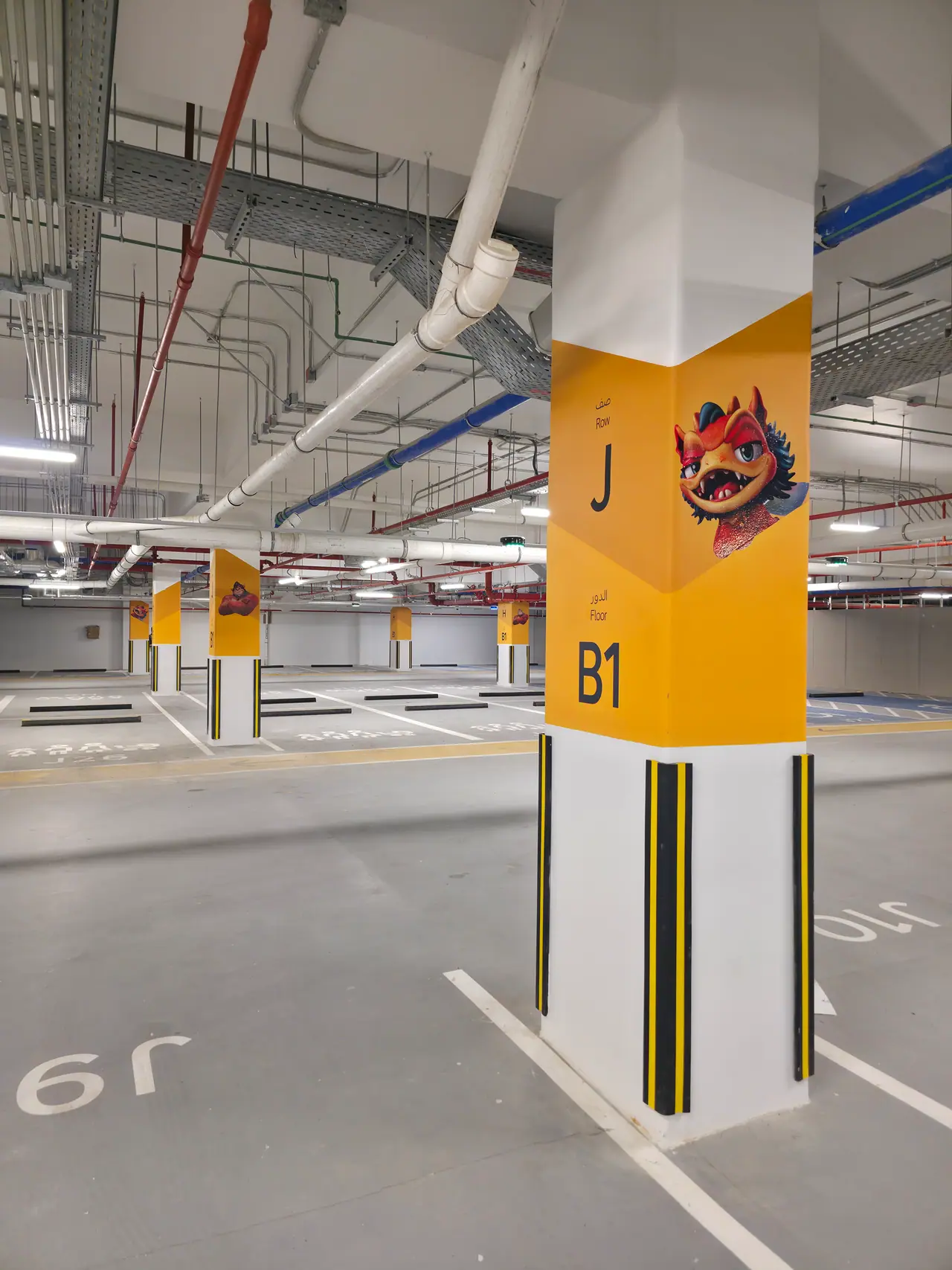Seven Abha — Destination Graphics & Wayfinding — Zone-coded column graphic, parking level B1