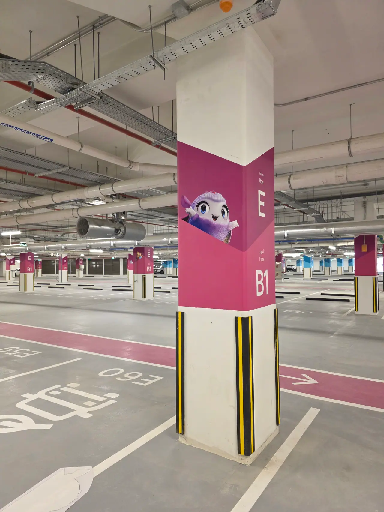 Seven Abha — Destination Graphics & Wayfinding — Each parking zone carries its own colour and character