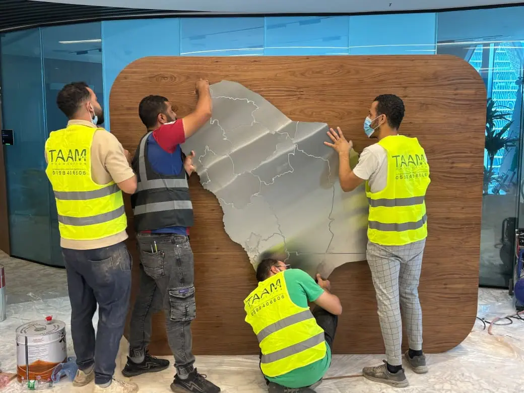 Shareek — Illuminated Map Wall — Our crew fitting the map panels